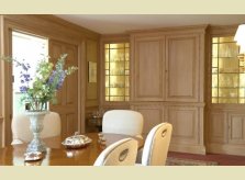Pine panelled dining room with concealed wet bar, all stained to a custom colour by Hallidays' in house stainers